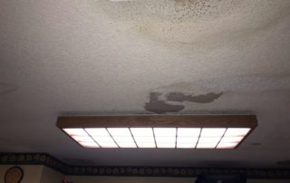 water damage and mold growth on ceiling